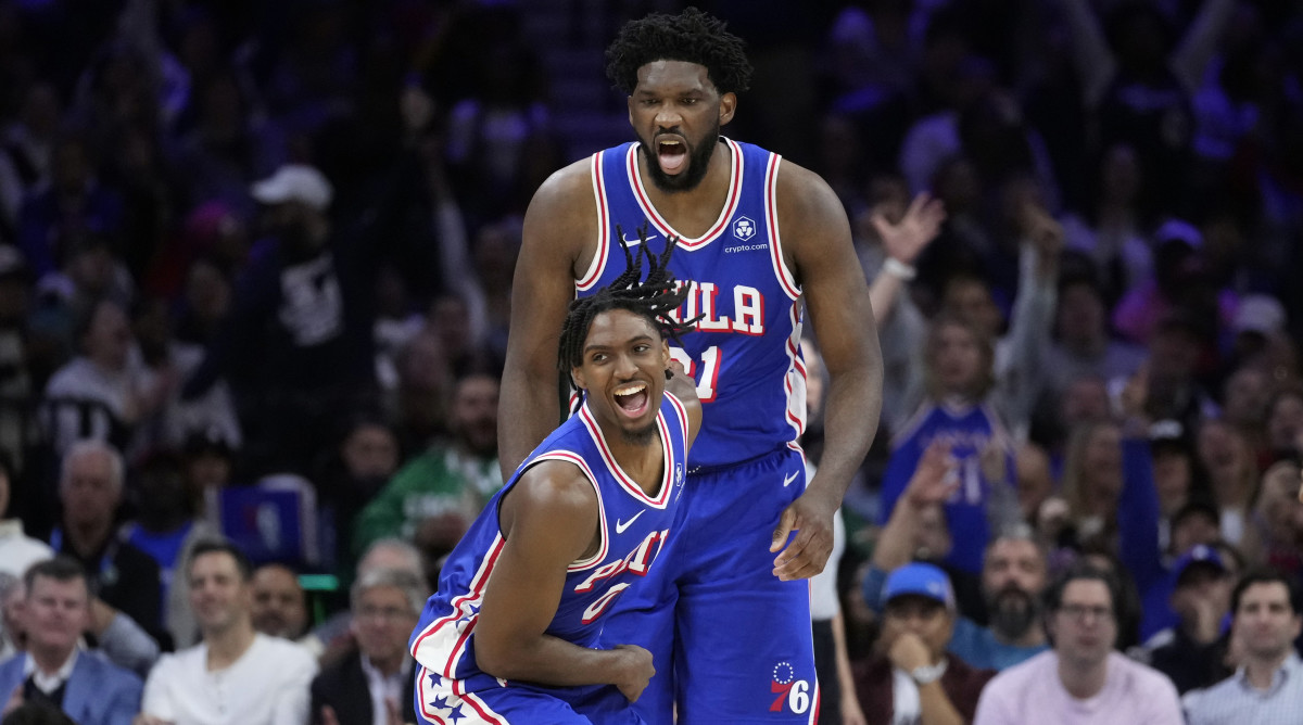 Philadelphia 76ers’ Tyrese Maxey and Joel Embiid celebrate after scoring vs. the Boston Celtics.